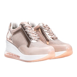 Deportivas de oro rosa en la cuña Jimena rosado 1