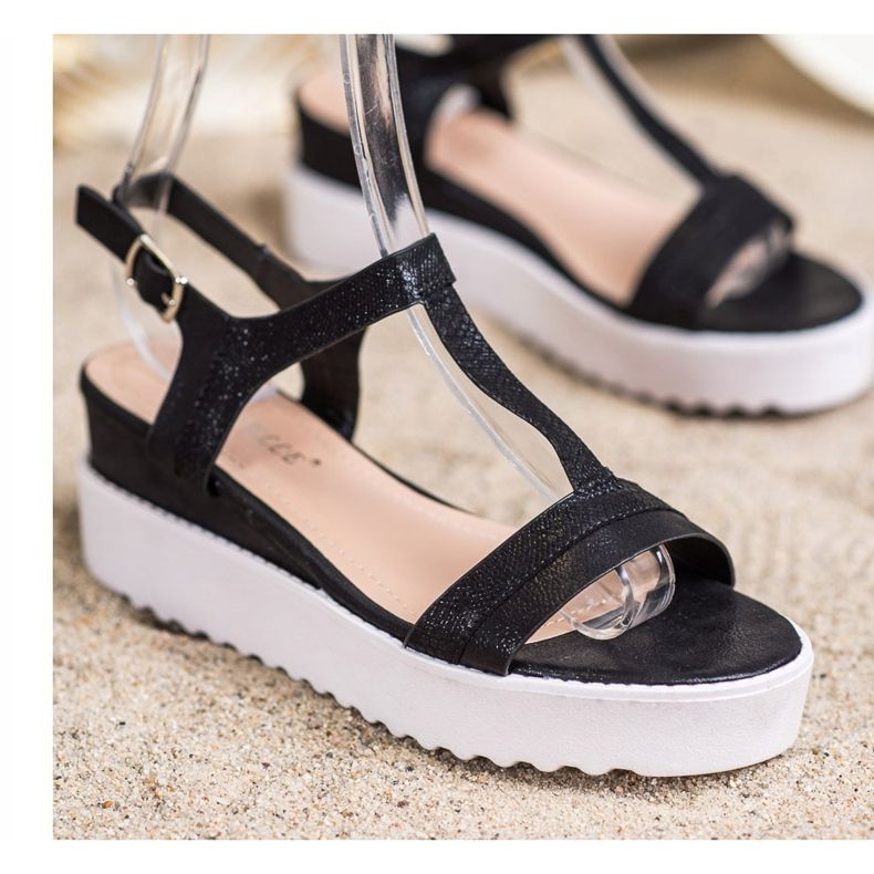 Bestelle Sandalias de cuña relucientes negro 1