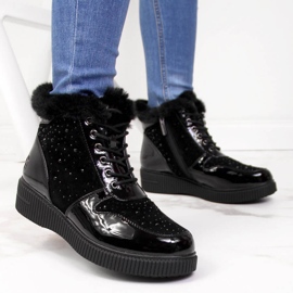 Botas de cuero con aislamiento de cuero negro Rieker 93312-00 en la plataforma 7