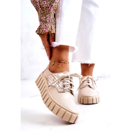 Lemar Zapatos de cuero beige y dorado sobre plataforma. 1